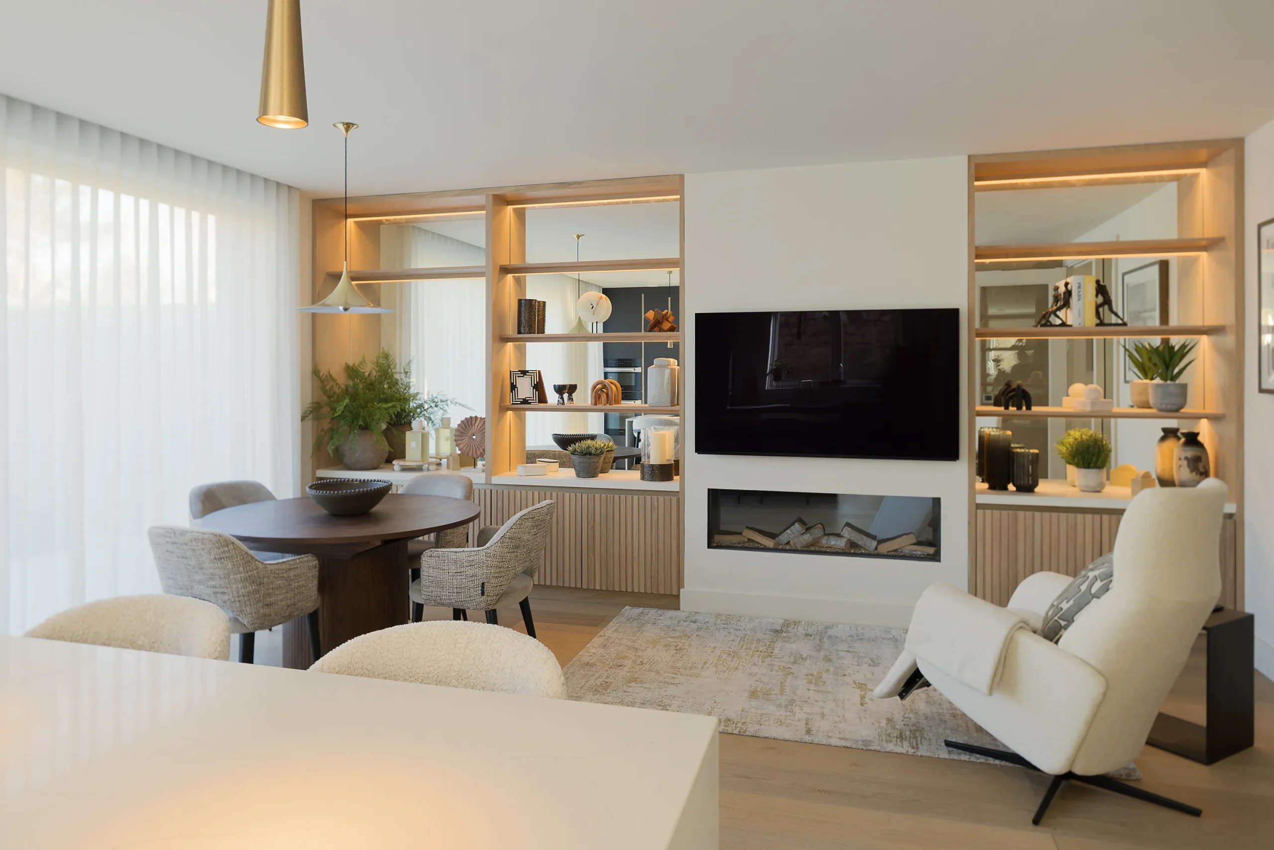 Interior design and joinery detail from the Blackrock home by Gavelle, in a palette of matte charcoal, warm oak, brushed brass and natural stone