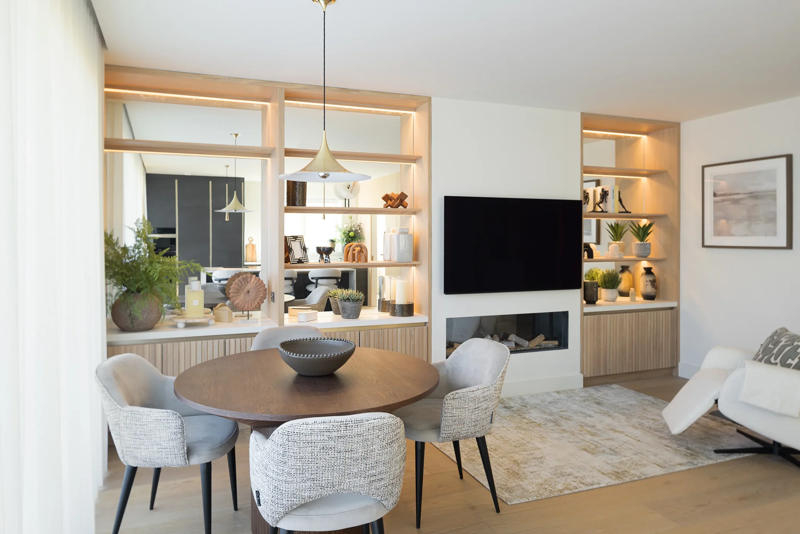 Interior design and joinery detail from the Blackrock home by Gavelle, in a palette of matte charcoal, warm oak, brushed brass and natural stone