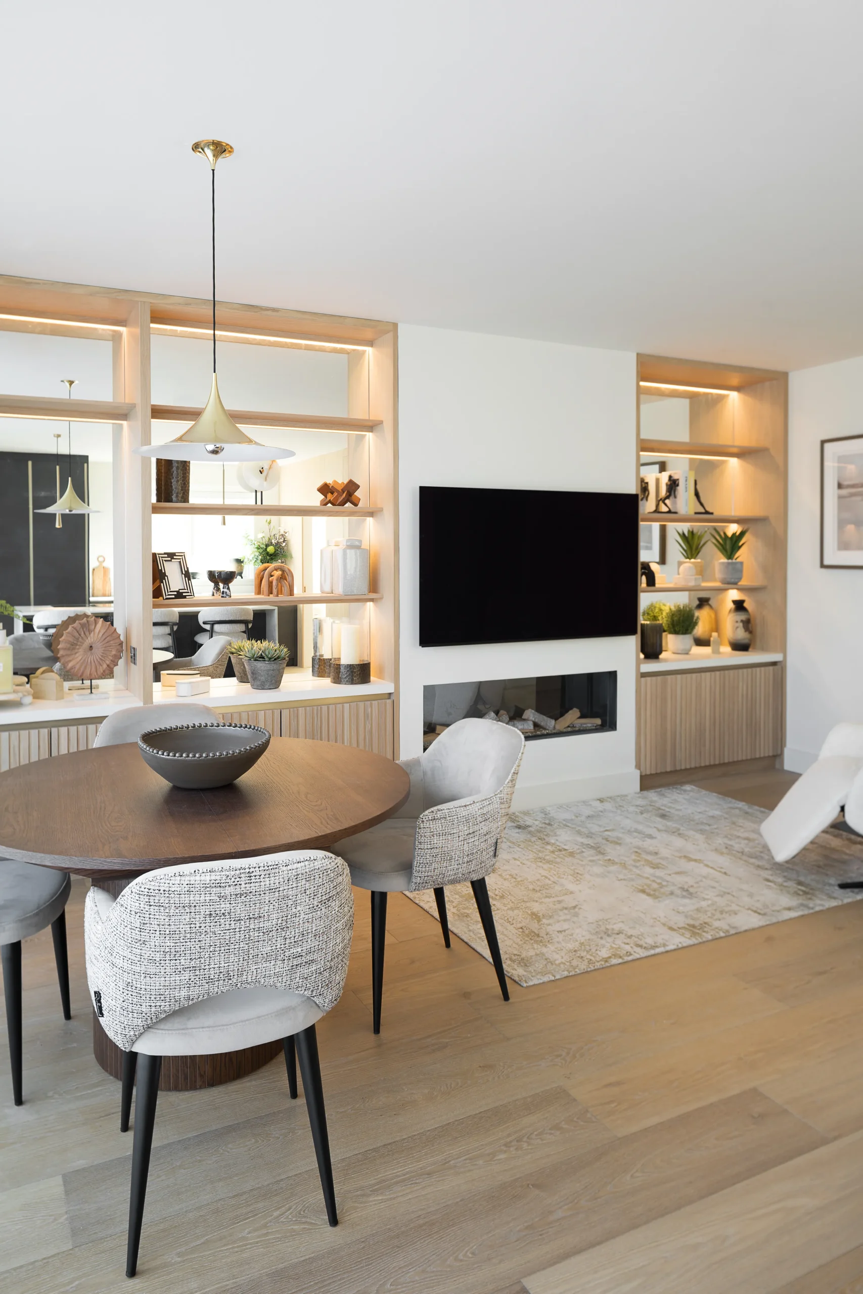 Interior design and joinery detail from the Blackrock home by Gavelle, in a palette of matte charcoal, warm oak, brushed brass and natural stone