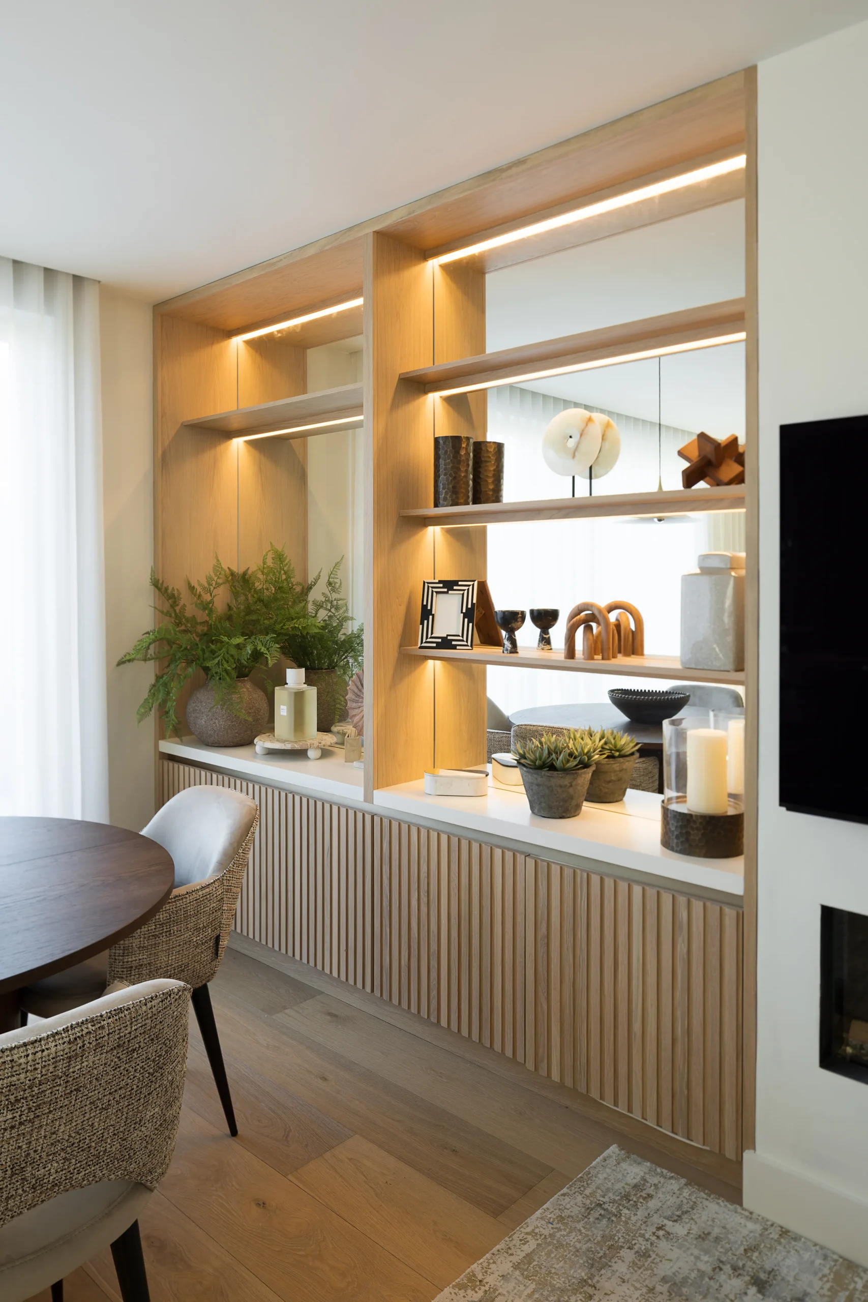 Interior design and joinery detail from the Blackrock home by Gavelle, in a palette of matte charcoal, warm oak, brushed brass and natural stone