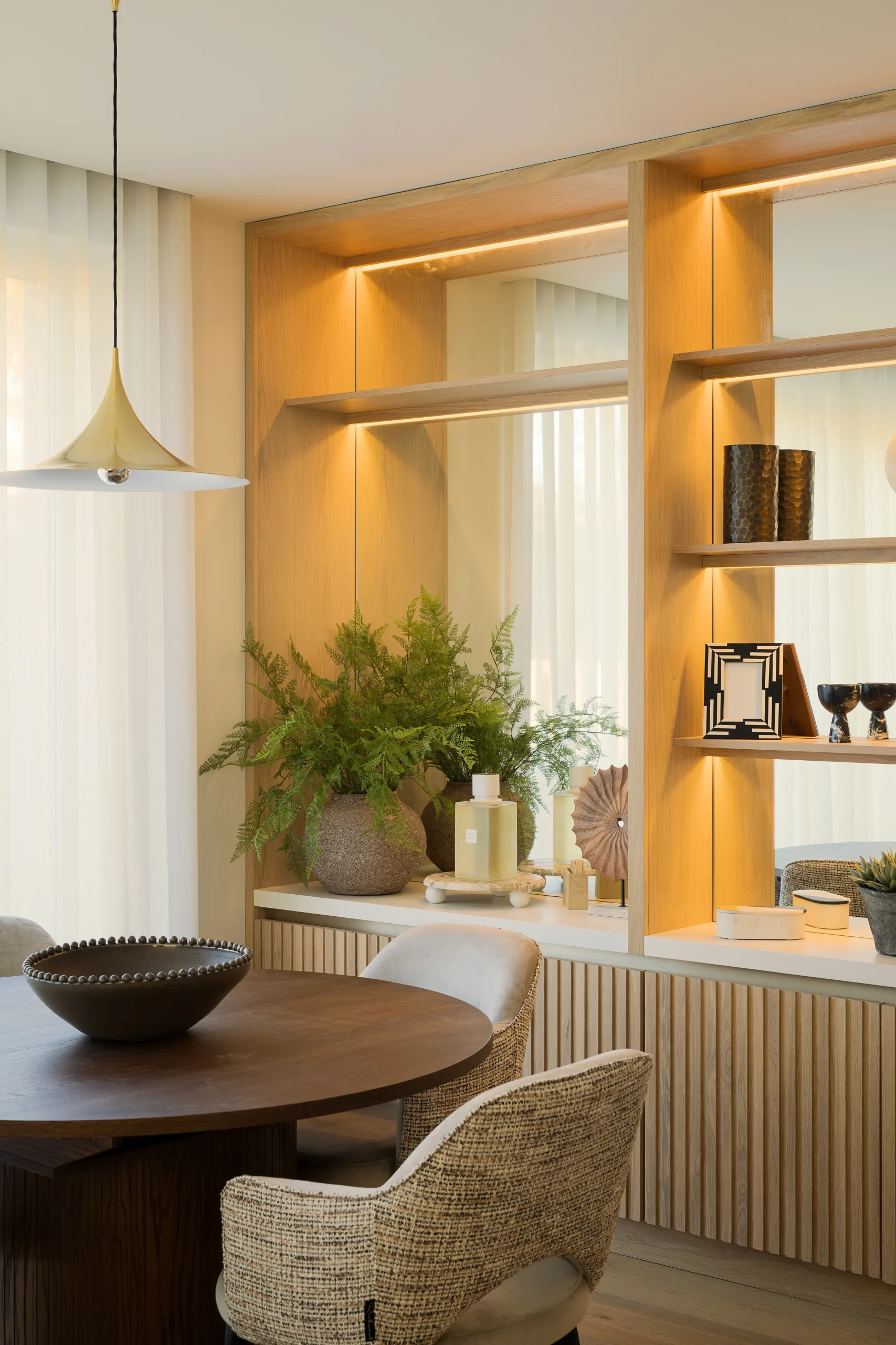 Interior design and joinery detail from the Blackrock home by Gavelle, in a palette of matte charcoal, warm oak, brushed brass and natural stone