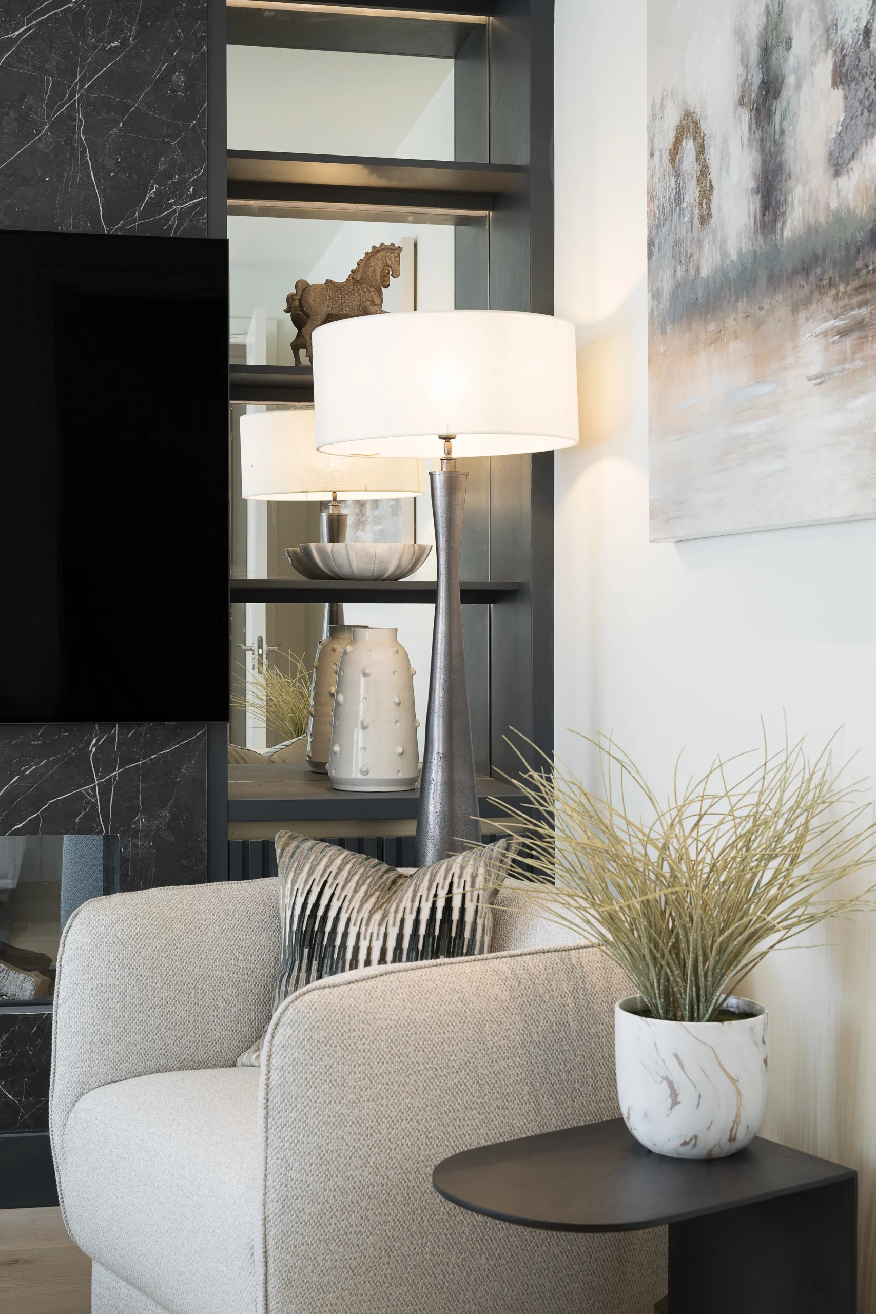 Interior design and joinery detail from the Blackrock home by Gavelle, in a palette of matte charcoal, warm oak, brushed brass and natural stone