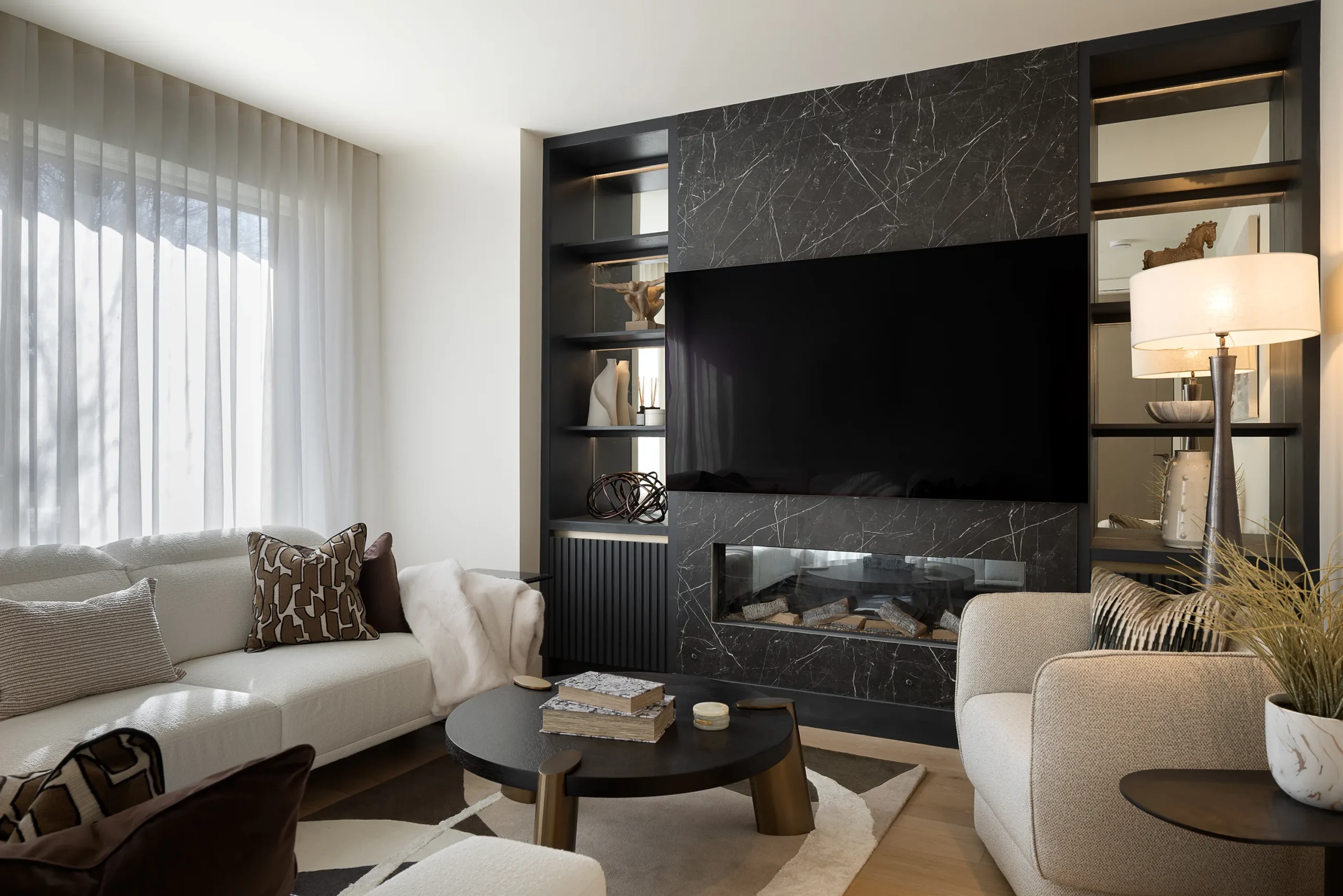 Interior design and joinery detail from the Blackrock home by Gavelle, in a palette of matte charcoal, warm oak, brushed brass and natural stone