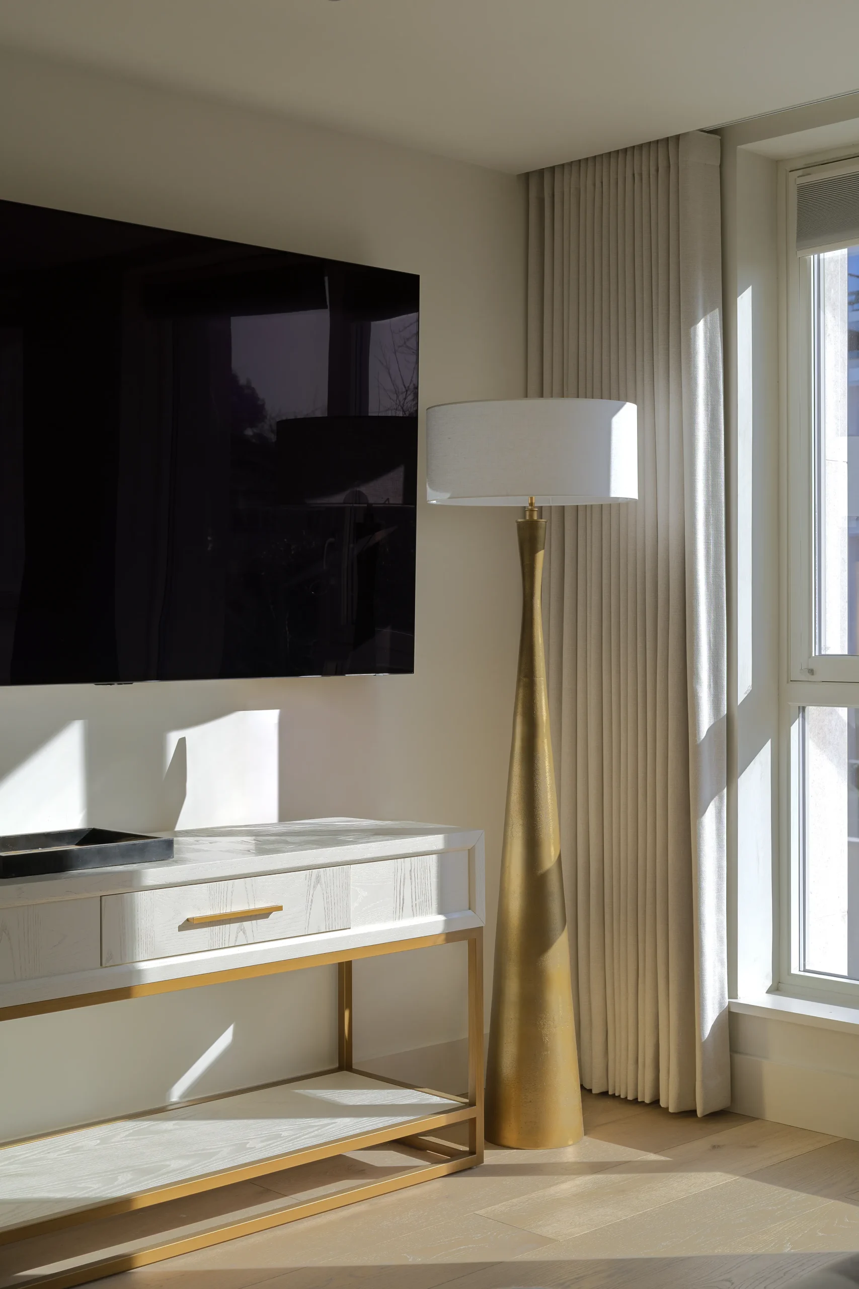 Interior design and joinery detail from the Blackrock home by Gavelle, in a palette of matte charcoal, warm oak, brushed brass and natural stone