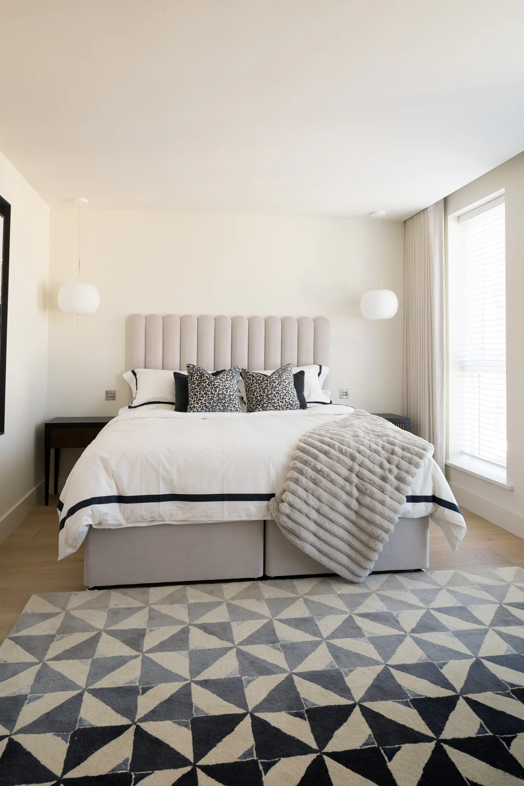 Interior design and joinery detail from the Blackrock home by Gavelle, in a palette of matte charcoal, warm oak, brushed brass and natural stone