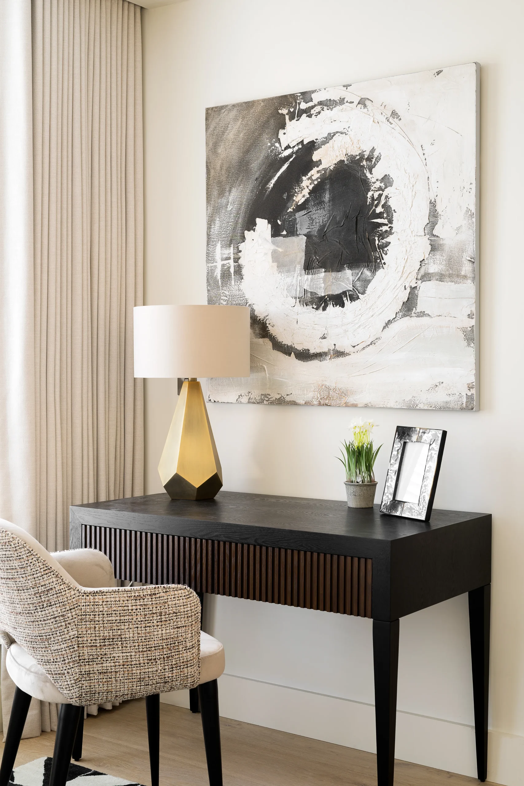 Interior design and joinery detail from the Blackrock home by Gavelle, in a palette of matte charcoal, warm oak, brushed brass and natural stone