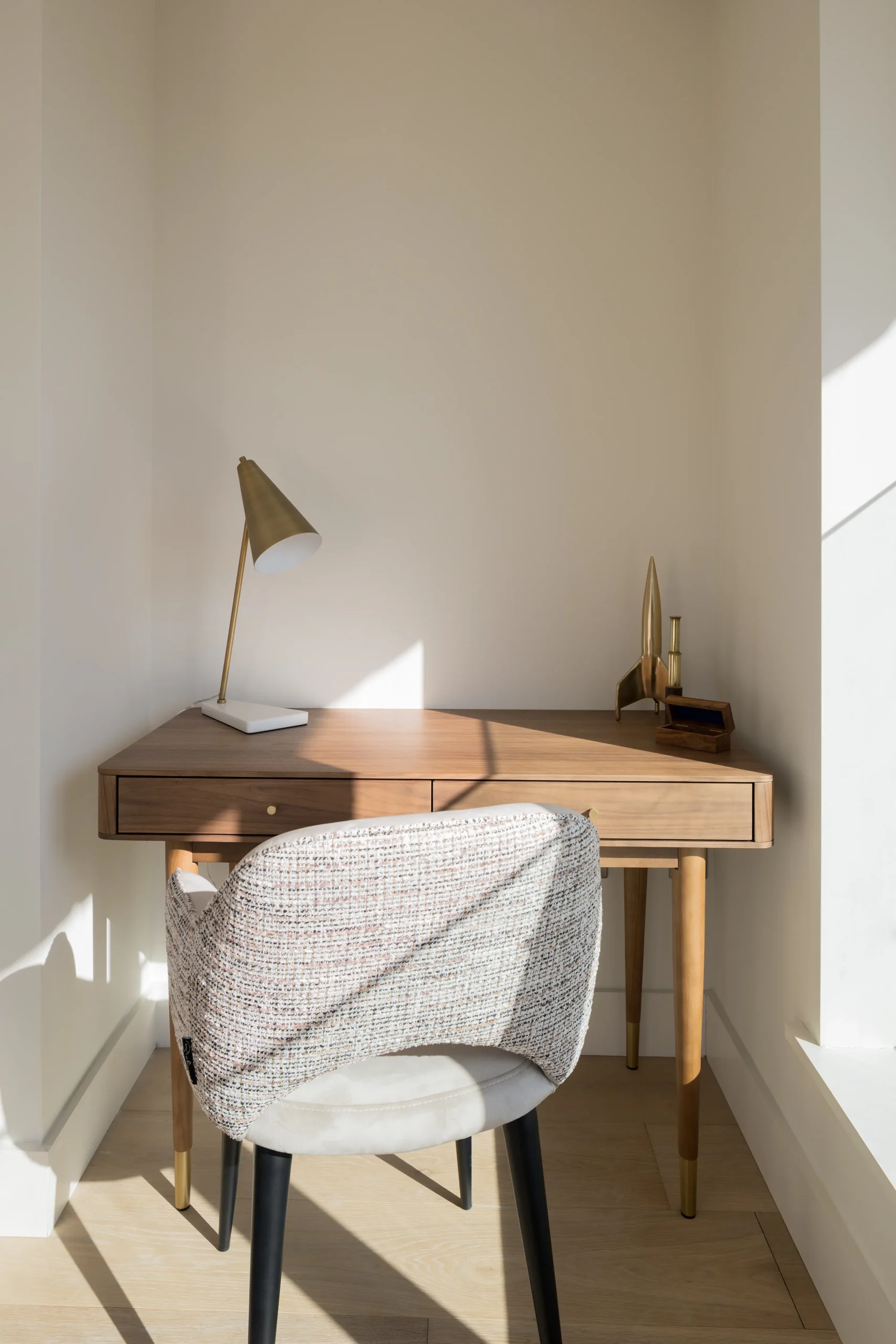 Interior design and joinery detail from the Blackrock home by Gavelle, in a palette of matte charcoal, warm oak, brushed brass and natural stone