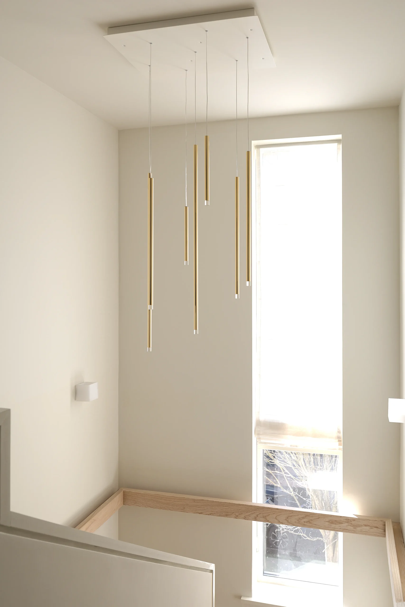 Interior design and joinery detail from the Blackrock home by Gavelle, in a palette of matte charcoal, warm oak, brushed brass and natural stone